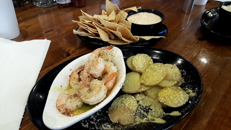 Seafood dishes on a dining table.