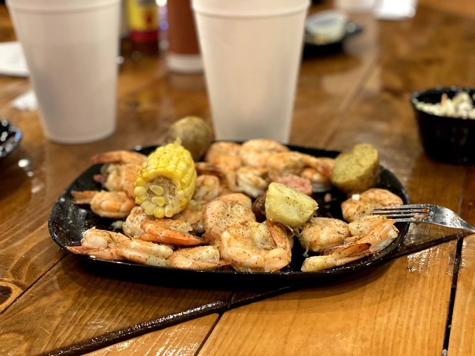Seafood dishes on a dining table.